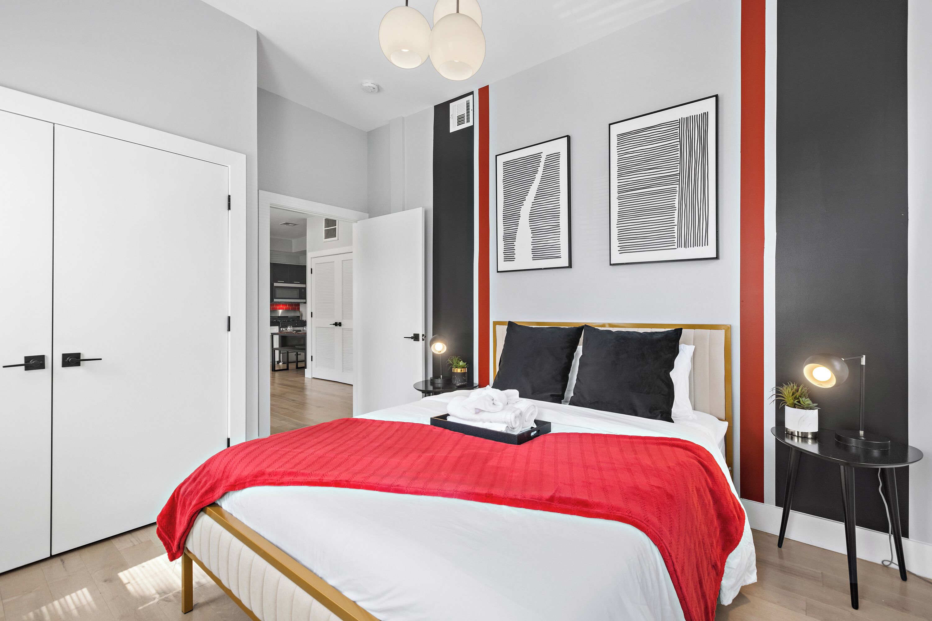 Inviting bedroom with a comfortable queen bed, bathed in soothing natural light, offering a tranquil space for a peaceful night's rest.




