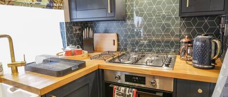 Fridge, electric kettle, toaster, cookware/dishes/utensils