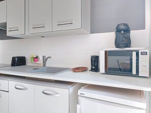 Fridge, microwave, toaster, cookware/dishes/utensils