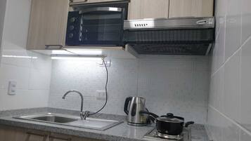 Fridge, oven, electric kettle, cookware/dishes/utensils