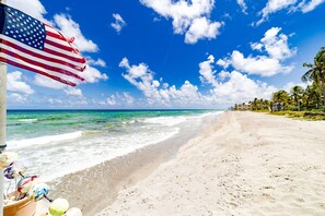 On the beach, sun-loungers, beach towels