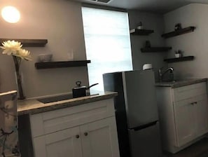 Fridge, microwave, stovetop, coffee/tea maker