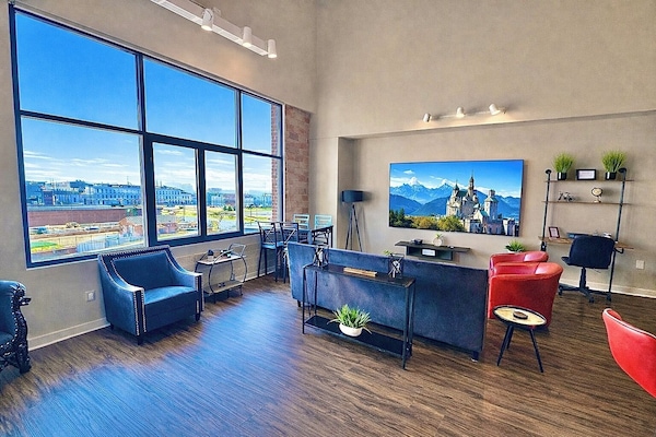 Open-concept living area with cozy seating, modern finishes, and plenty of space to unwind. Ideal for groups to relax and enjoy time together.