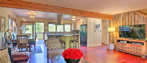 Smart TV, fireplace, books, computer monitors