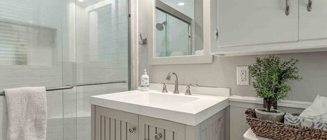 Bathtub, hair dryer, towels, soap