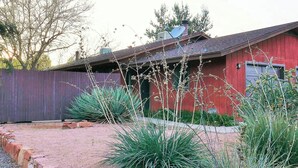 A red building with a sloped roof and satellite dish. - Recently acquired property that's a work in progress (Sedona)