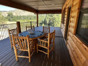 Outdoor dining - Secluded 7,800 SqFt Cabin in the Woods- Pond, River, Theater, Disc Golf & More (Featherville)