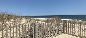 Dog-friendly 1st-floor end condo with beach entrance view - steps to the beach