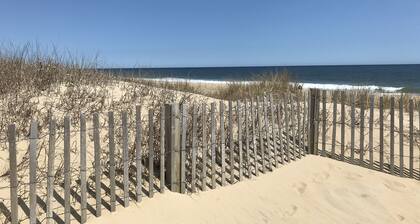 Dog-friendly 1st-floor end condo with beach entrance view - steps to the beach