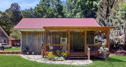 Serene waterfront home with firepit, deck, & central AC
