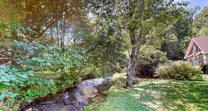 Serene waterfront home with firepit, deck, & central AC