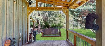 Serene waterfront home with firepit, deck, & central AC