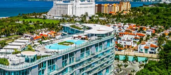 Stylish ocean-view condo with pool, gym, private balcony, AC, & WiFi