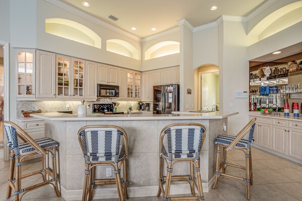 Fridge, microwave, oven, stovetop - Waterfront home with saltwater pool, pool spa, central AC, W/D, & office space (Marco Island)