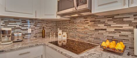 Fridge, microwave, stovetop, coffee/tea maker