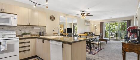 Condo, 1 King Bed with Sofa bed, Balcony, Garden View | Private kitchen | Fridge, microwave, oven, stovetop