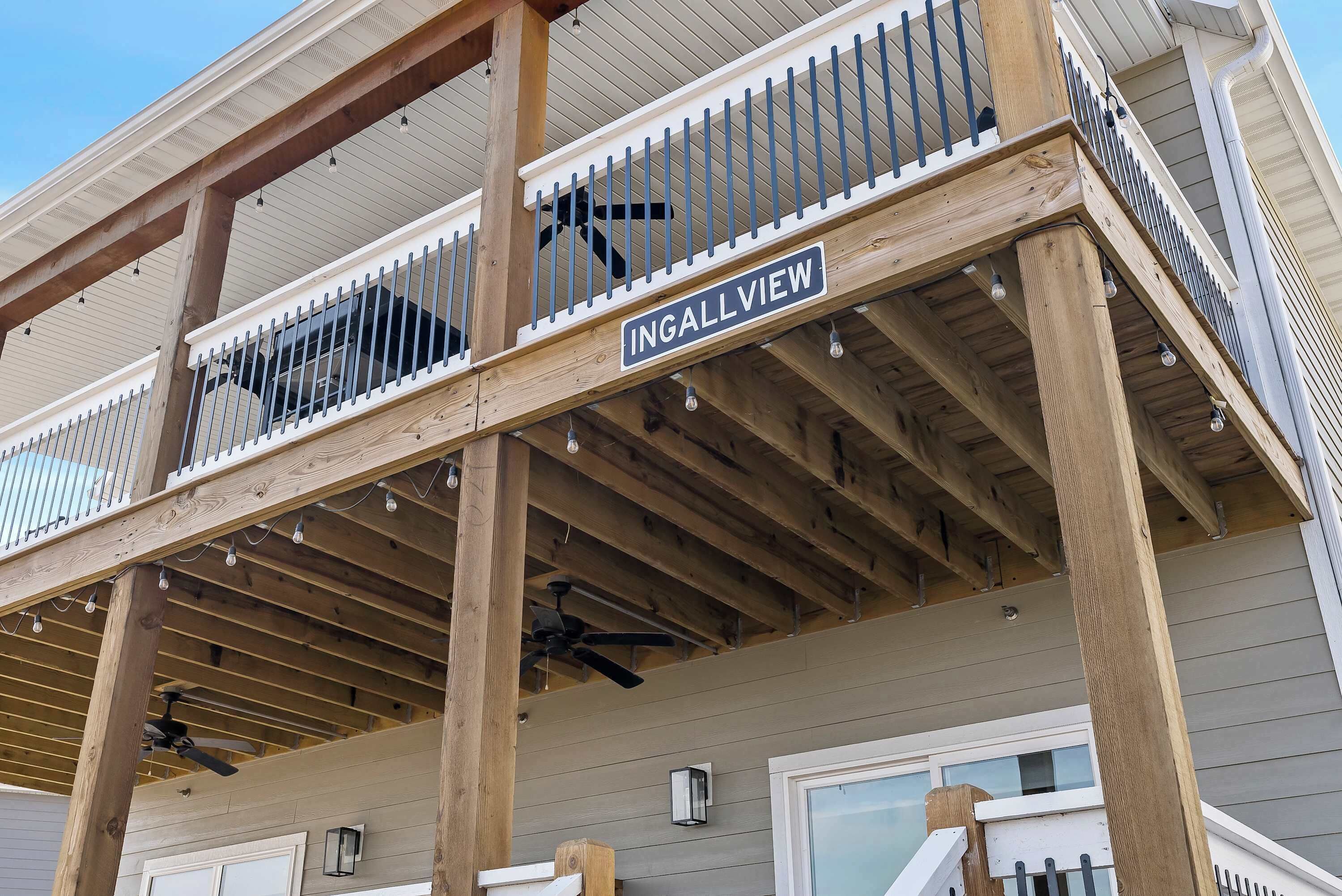 A wooden balcony with a sign reading "INGALLVIEW."