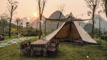 Comfort Tent | In-room safe, individually decorated, individually furnished, desk