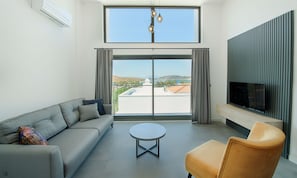 Duplex | Living area | 140-cm flat-screen TV with satellite channels, TV - Lodos Suites & Residence (Bodrum)