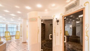 A spa area with a glass door labeled 'Finische Sauna,' yellow chairs, and a patterned floor. - 'Residence Diana Apartment 101' with Mountain View, Balcony & Wi-Fi (Terenten)