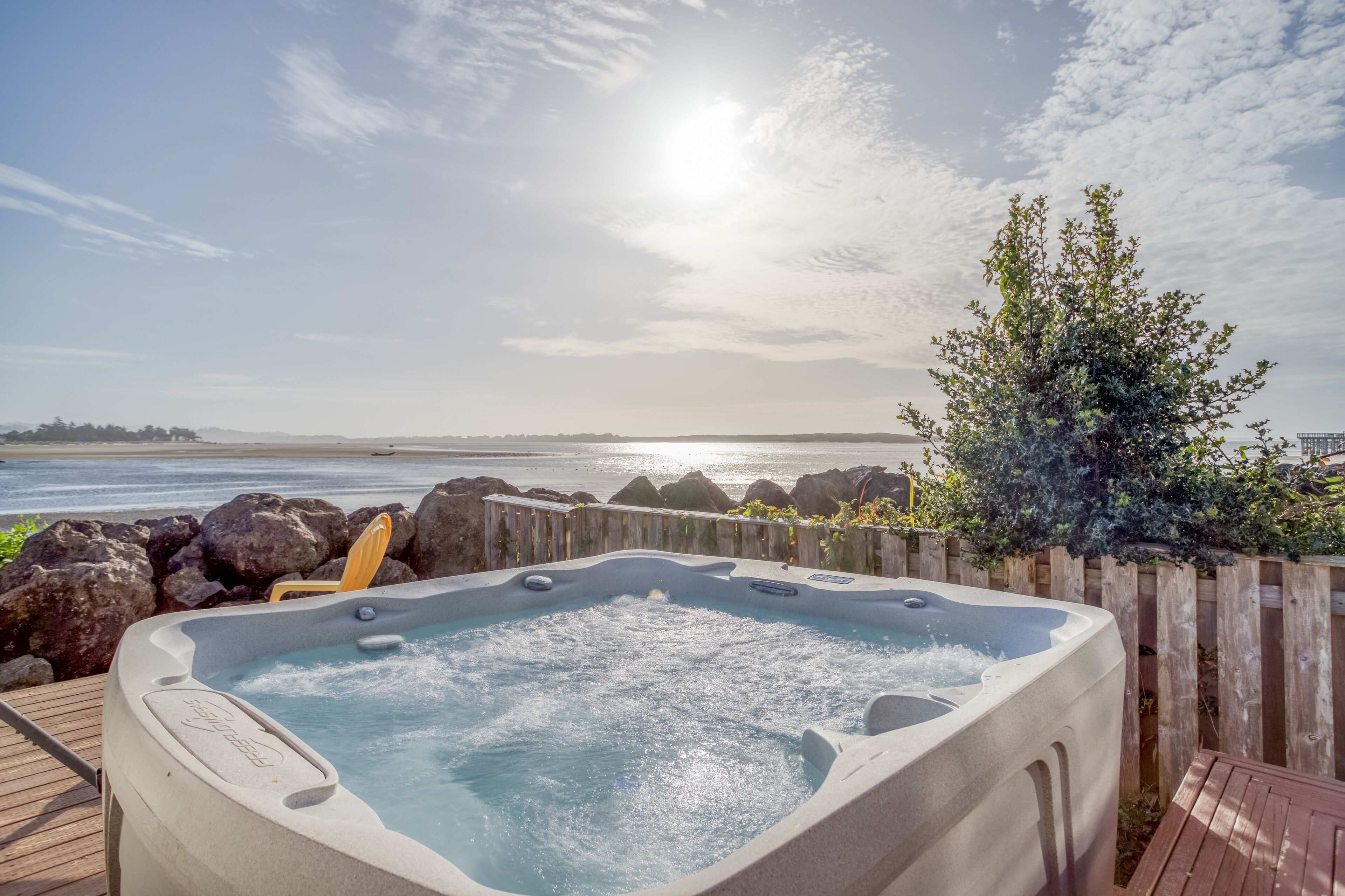 1920's Updated Cottage Fronting Siletz Bay with Deck, Firepit, BBQ, and Hot Tub