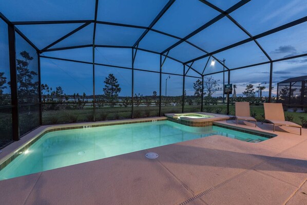 Relax by the pool, surrounded by a tranquil landscape and a transparent roof.