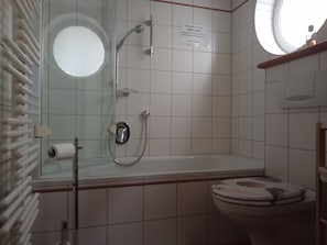 Combined shower/tub, hair dryer, towels, soap