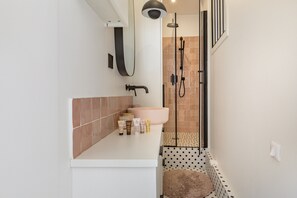 Bathtub, hair dryer, towels, soap