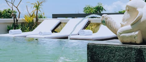 Outdoor pool, open 7:00 AM to 7:00 PM, pool loungers