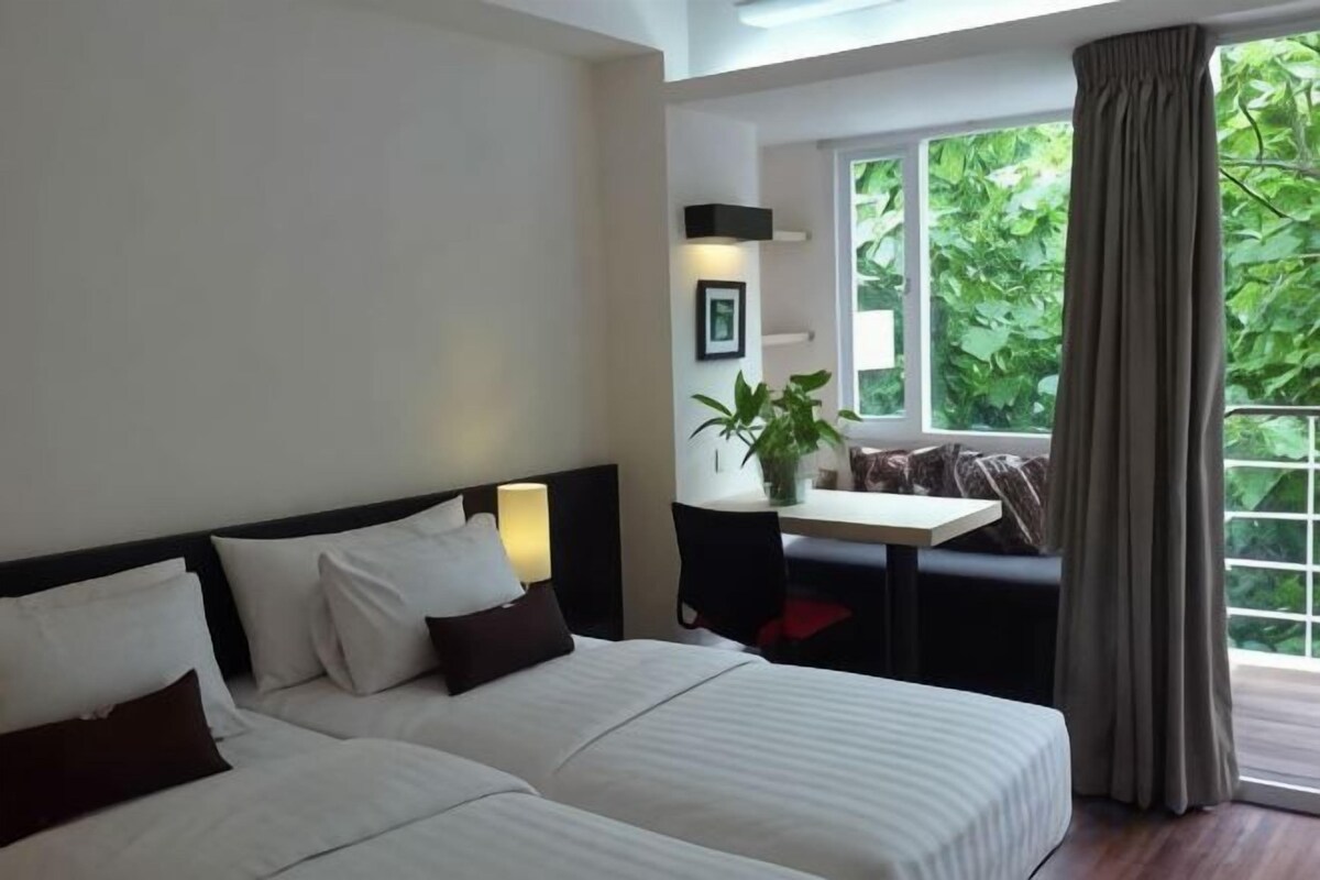 Premium bedding, pillow-top beds, desk, laptop workspace