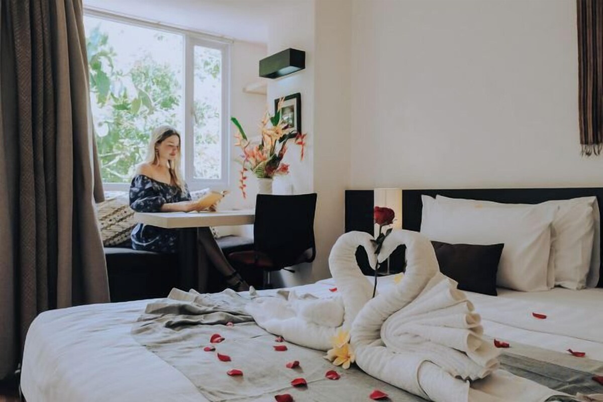 Premium bedding, pillow-top beds, desk, laptop workspace