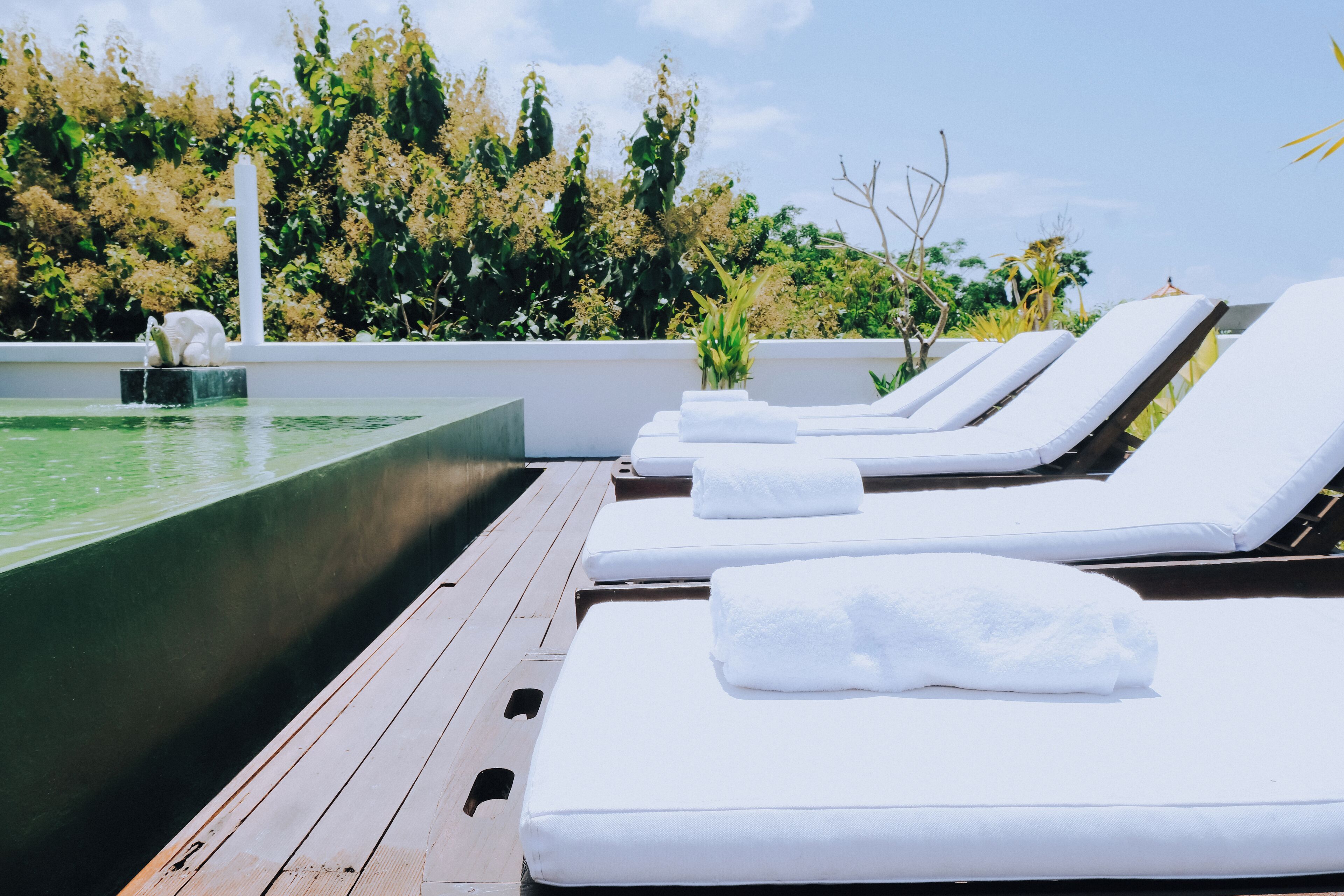 Outdoor pool, open 7:00 AM to 7:00 PM, pool loungers