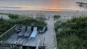 A wooden deck with lounge chairs and a pathway leading to the beach. - SeaAira: Oceanfront with unbeatable ocean views, renovated kitchen and baths (Nags Head)