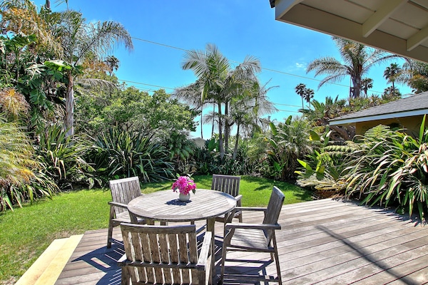 Relax in a tropical oasis and enjoy a meal or take in the south facing sun.