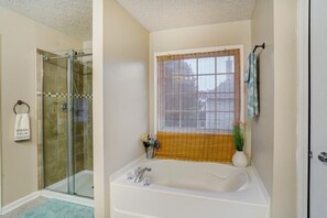 Combined shower/bathtub, hair dryer, towels, soap