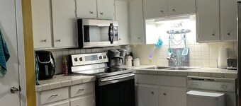 Charming water front cottage on Cane River with stunning sunroom & private decks