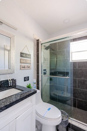 Shower, eco-friendly toiletries, hair dryer, towels