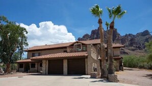 A two-story house with a red-tiled roof, a balcony, and a garage. - Superstition Mountains Apache Junction - sleeps 16 (Apache Junction)