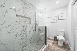 Combined shower/tub, hair dryer, towels, soap