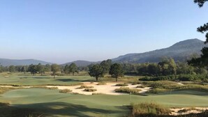 A golf course with sand bunkers, trees, and a distant mountain. - Historic home in quaint town of South Pittsburg. Just off I-24. (South Pittsburg)