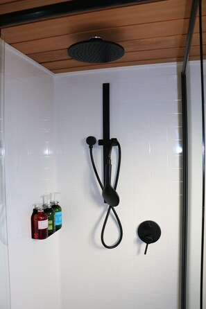 Deluxe Cabin | Bathroom | Slippers, soap, shampoo, toilet paper - The Pink Lake Tiny House - 'sakura' (Lochiel)