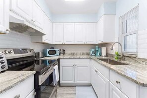 Fridge, microwave, oven, stovetop - Downtown Escape! All new! Cute Villa in Sarasota! (Sarasota)
