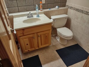 Combined shower/tub, hair dryer, towels, soap