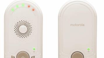 A white Motorola device with a circular speaker, a power button, and directional controls.