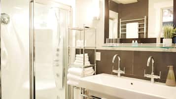Bathtub, hair dryer, towels, soap