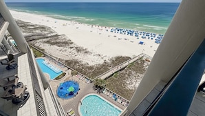 A hotel with a pool area, beach access, and a view of the ocean. - Oasis, formerly Phoenix West II, New Owner, Beachfront and WaterSlide!! (Orange Beach)