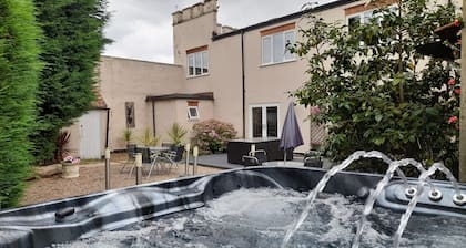 Relax and unwind at our hot tub retreat, close to activities, trails, water park
