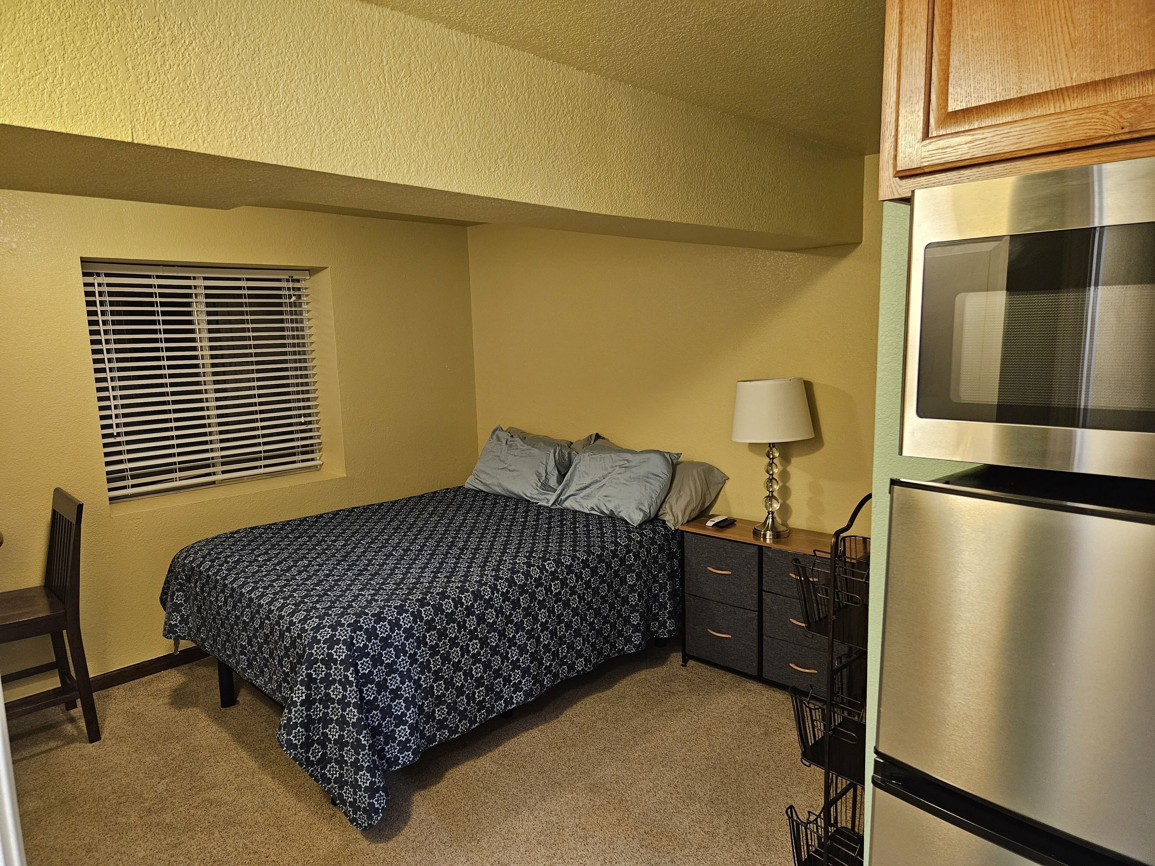 Bright and private basement studio with full laundry in rental.