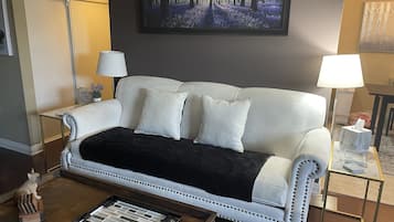 Smart TV, fireplace, books, printers