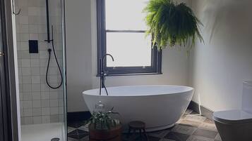 Bathtub, hair dryer, towels, soap